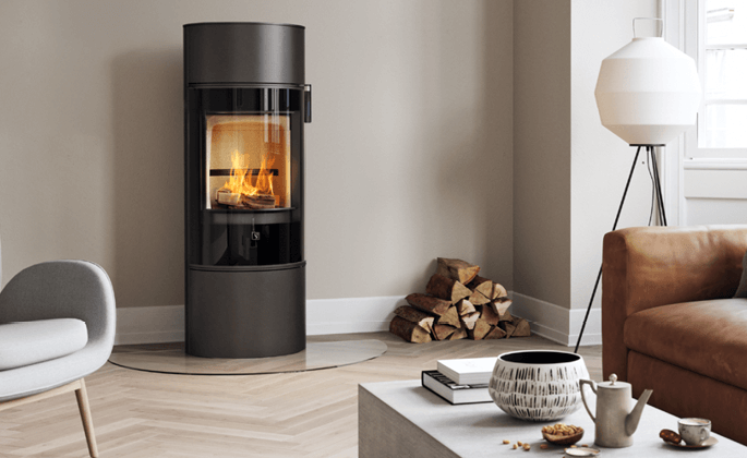 Black wood-burning stove Scan 84 in a modern bright room