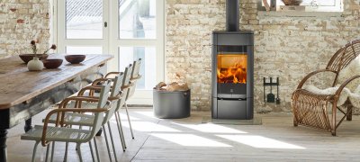 Scan 65-1 stove in Scandinavian interior in front of a light brick wall