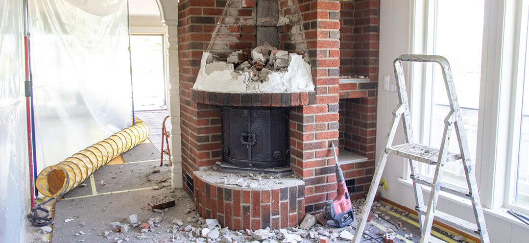 Rip old fireplace in red brick