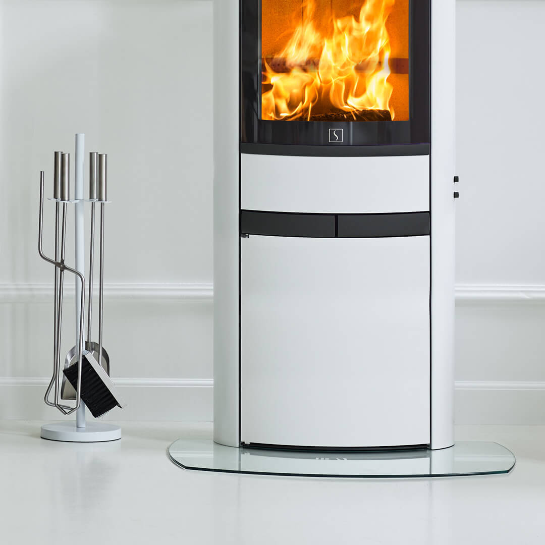 Scan 68-13 white wood stove with black handles on white floor